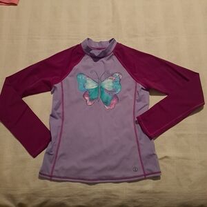 Lands' End girls size 14 long sleeved swim rashguard, has mark on back